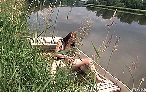 Alexis crystal pleasures herself outside in a canoe