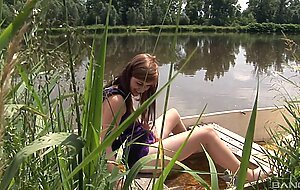 Alexis crystal pleasures herself outside in a canoe